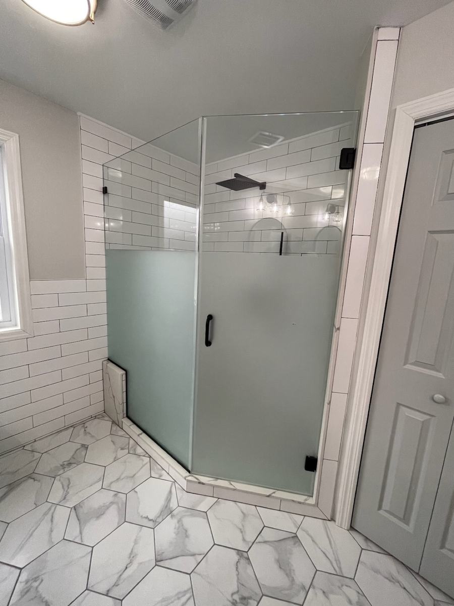Frosted glass neo-angle shower enclosure with matte black hardware