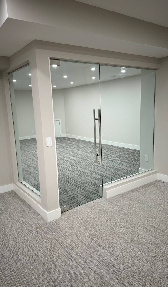 Frameless glass office partition with sliding door